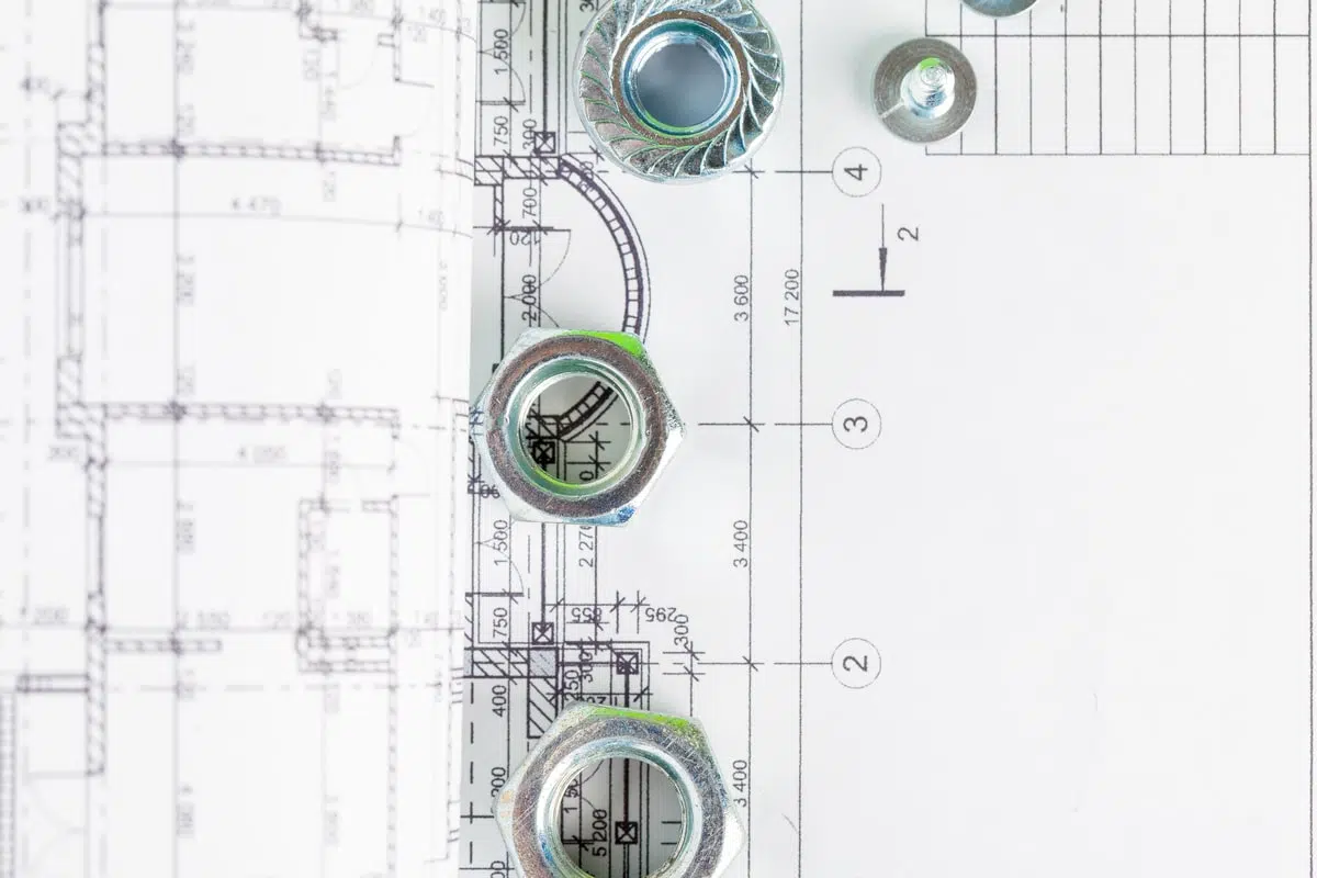 nuts-and-bolts-close-up-over-house-plan-2023-11-27-04-54-04-utc-min